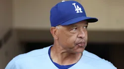 Manager Dave Roberts of the Los Angeles Dodgers looks on from the dugout during a game against the San Diego Padres.