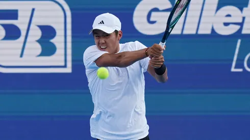 Learner Tien of the United States plays a backhand.