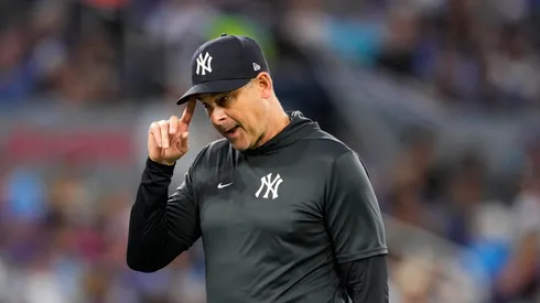 Aaron Boone walks back after making a pitching change on July 3, 2025 in Ontario, Canada.
