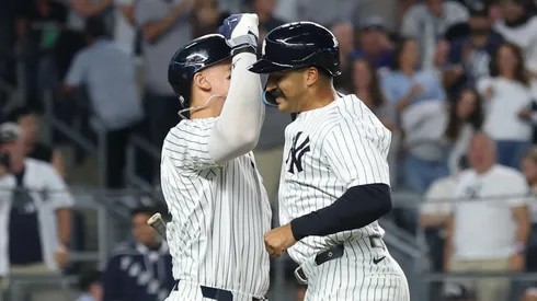 Trent Grisham #12 of the New York Yankees celebrates his solo home run with Aaron Judge #99.