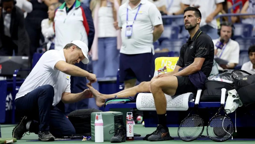 Novak Djokovic receives medical attention during his first round match at the 2025 US Open (Getty Images)