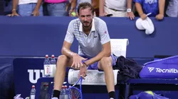 Daniil Medvedev breaks his racket after losing.