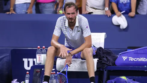 Daniil Medvedev breaks his racket after losing.