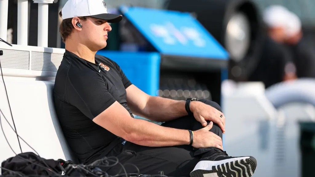 Trey Hendrickson looks on from the bench