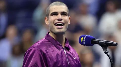 Carlos Alcaraz of Spain speaks to the crowd after defeating Reilly Opelka.