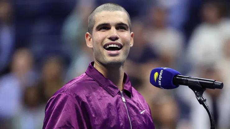 Carlos Alcaraz of Spain speaks to the crowd after defeating Reilly Opelka.