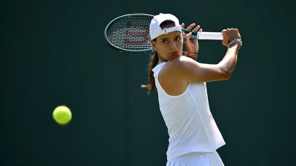 Emiliana Arango plays a backhand during the Ladies’ Singles first round match on day two of The Championships Wimbledon 2025. (Source: Hannah Peters/Getty Images)