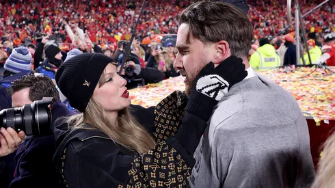 Taylor Swift celebrates with Travis Kelce #87 of the Kansas City Chiefs.