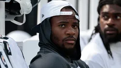 Micah Parsons #11 of the Dallas Cowboys sits on the sidelines.
