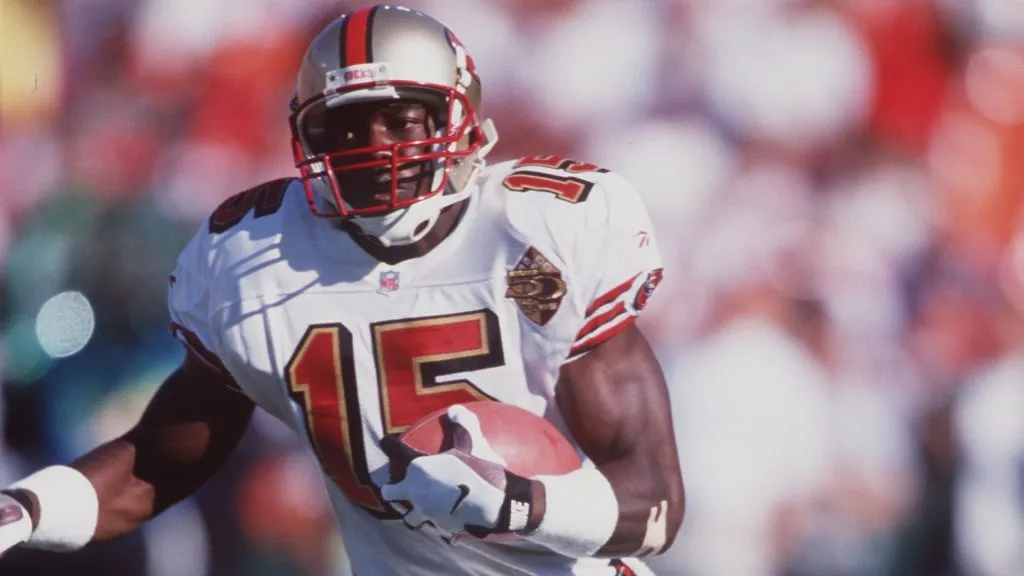 Terrell Owens of the San Francisco 49ers carries the football during the 49ers versus San Diego Chargers game in 1996. (Source: Jed Jacobsohn/ALLSPORT)