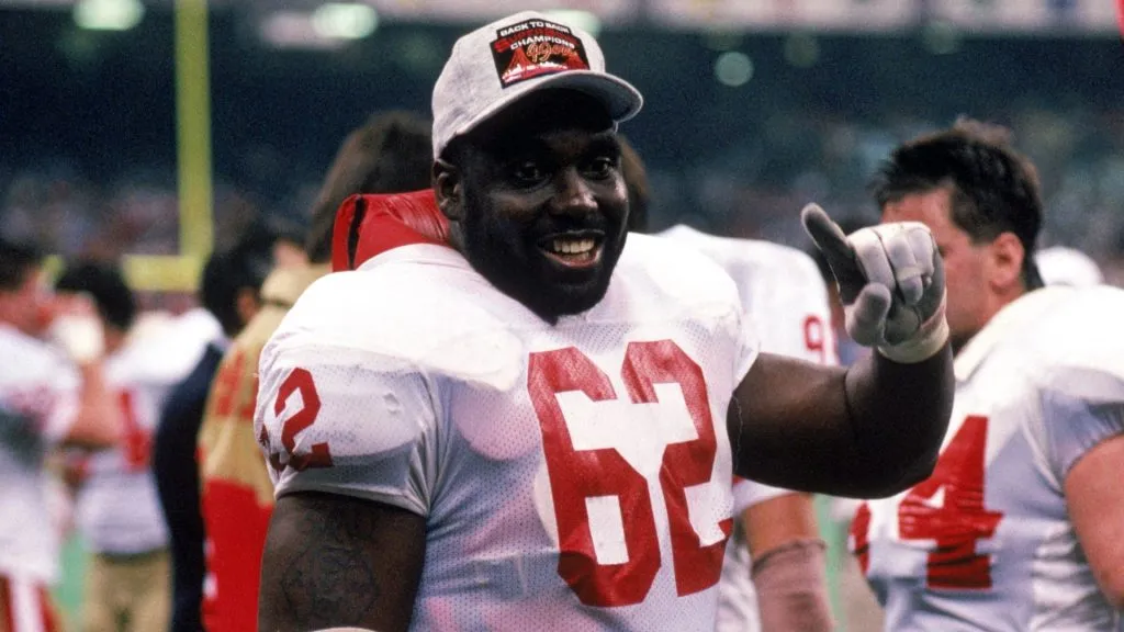 Guy McIntyre #62 of the San Francisco 49ers celebrates on the sidelines in Super Bowl XXIV. (Source: George Rose/Getty Images)