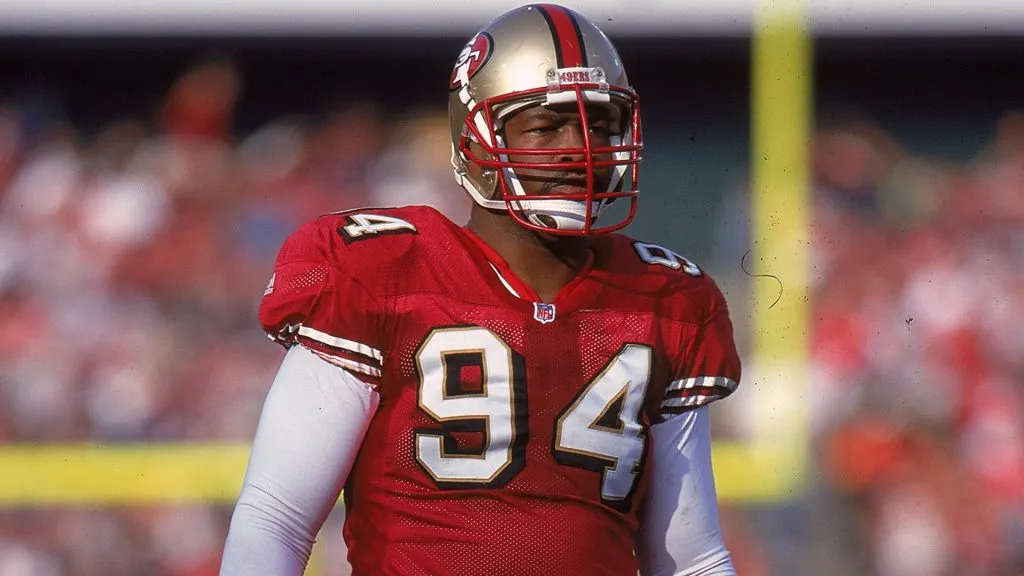 Charles Haley #94 of the San Francisco 49ers looks on from the field during a game in 1999. (Source: Tom Hauck /Allsport)