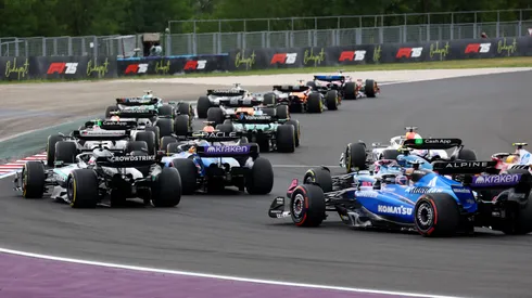 F1 drivers battling in Hungary Grand Prix.
