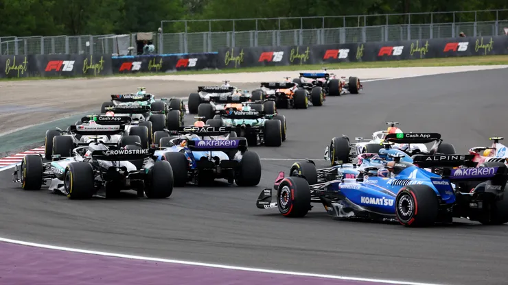 F1 drivers battling in Hungary Grand Prix.