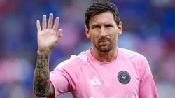 Lionel Messi waves to crowd.