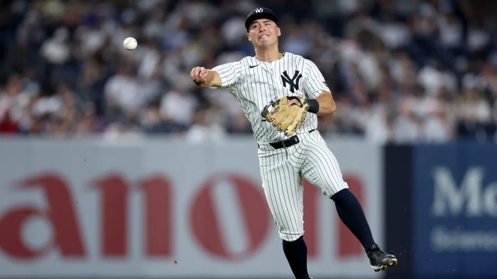 Anthony Volpe fields a hit against the Minnesota Twins at Yankee Stadium on August 12, 2025. (Photo by Elsa/Getty Images)