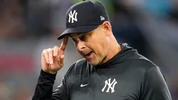 Manager Aaron Boone of the New York Yankees walks back to the dugout.