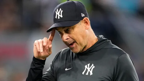 Manager Aaron Boone of the New York Yankees walks back to the dugout.