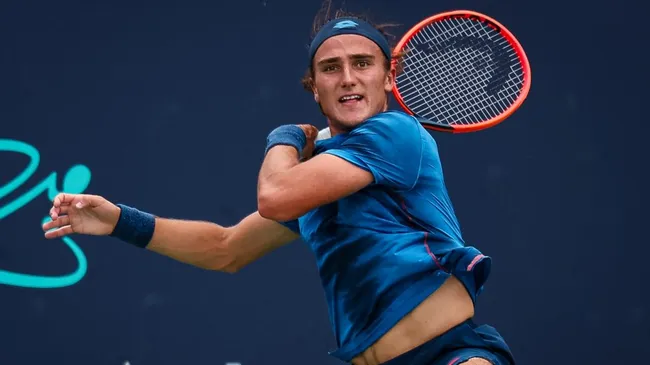 Mattia Bellucci returns a shot against Alex Michelsen during day 5 of the Mubadala Citi DC Open 2024. (Source: Scott Taetsch/Getty Images)