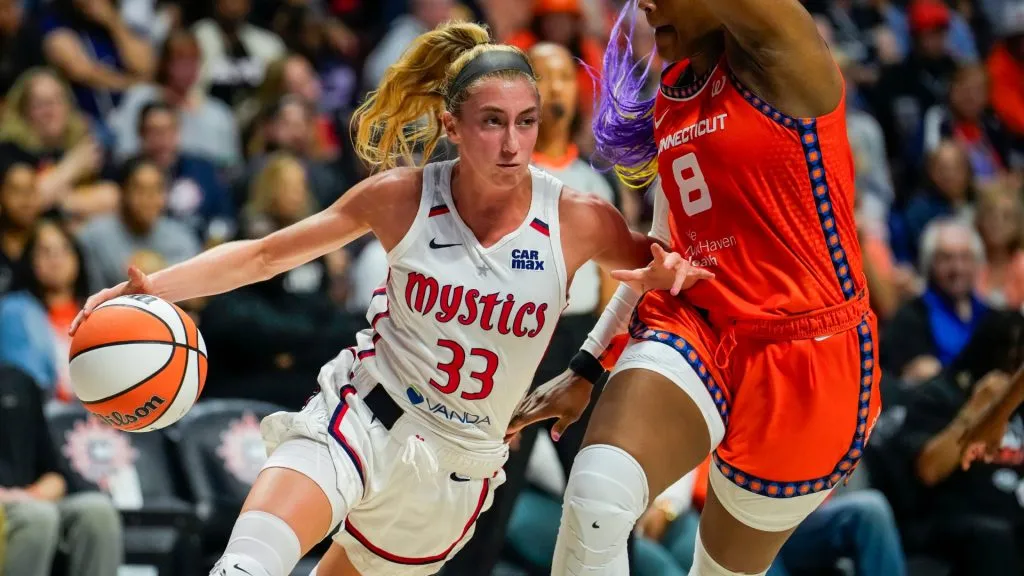 Lucy Olsen drives to the rim against Aaliyah Edwards #8 of the Connecticut Sun during the second half of a WNBA basketball game. (Source: Joe Buglewicz/Getty Images)