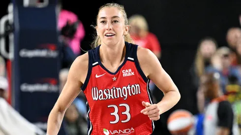 Lucy Olsen #33 of the Washington Mystics celebrates in the third quarter against the Indiana Fever in 2025.