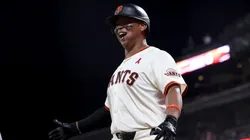 Rafael Devers #16 of the San Francisco Giants reacts after he hit a three-run home run.