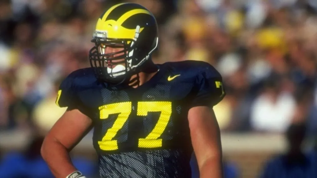 Jon Jansen #77 of the Michigan Wolverines looks on during a game against the Notre Dame Fighting Irish in 1997. (Source: Jonathan Daniel /Allsports)