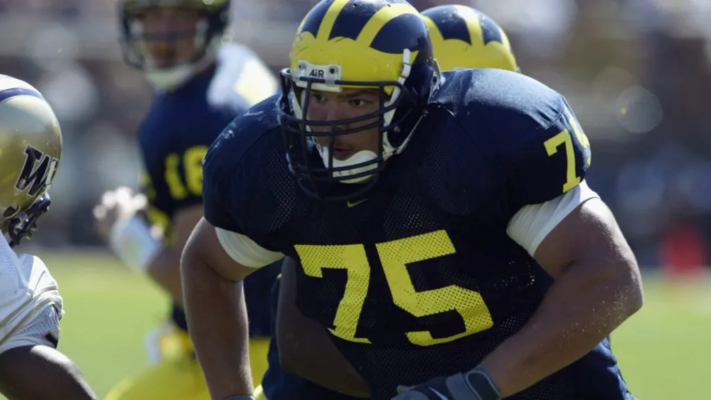 David Baas #75 of Michigan runs after the snap during the NCAA football game in 2002. (Source: Tom Pidgeon /Getty Images)