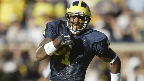 Braylon Edwards #1 of the Michigan Wolverines rushes after a reverse play against the Michigan State Spartans in 2004.