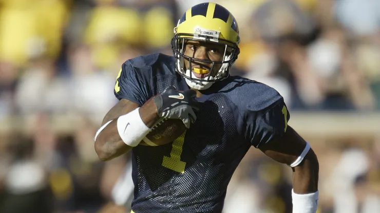 Braylon Edwards #1 of the Michigan Wolverines rushes after a reverse play against the Michigan State Spartans in 2004.