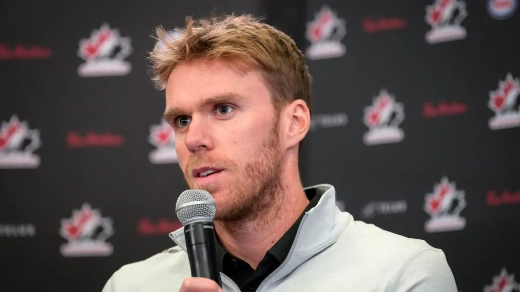 Connor McDavid holds a microphone