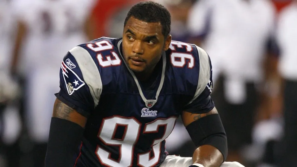 Richard Seymour #93 of the New England Patriots looks on while resting on his right knee against the Baltimore Ravens in 2008. (Source: Jim Rogash/Getty Images)