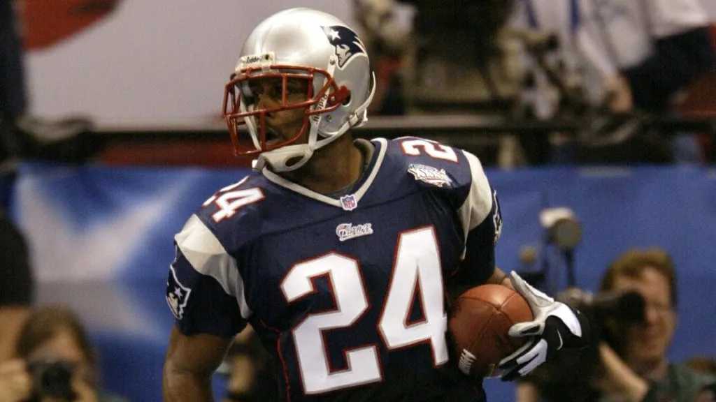 Ty Law #24 of the New England Patriots prepares to celebrate his interception touchdown during the first quarter of Super Bowl XXXVI. (Source: Brian Bahr/Getty Images)