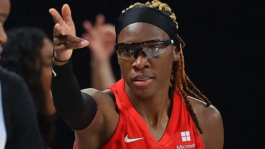 Rhyne Howard reacts after hitting a three-point basket against Kaela Davis #33 of the Chicago Sky in 2024. (Source: Kevin C. Cox/Getty Images)