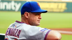 Carlos Mendoza looks on from the dugout vs the Braves on August 23, 2025 in Atlanta.