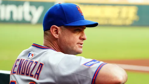 Carlos Mendoza looks on from the dugout vs the Braves on August 23, 2025 in Atlanta.