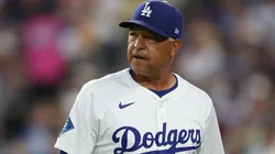 Manager Dave Roberts of the Los Angeles Dodgers looks on.