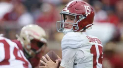 Ty Simpson #15 of the Alabama Crimson Tide looks to pass.