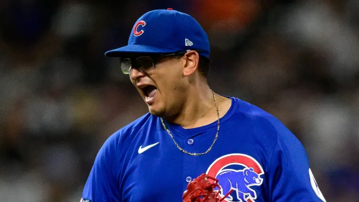 Javier Assad #72 of the Chicago Cubs celebrates after a strikeout.