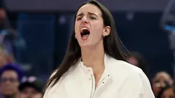 Injured Caitlin Clark #22 of the Indiana Fever cheers on her team.
