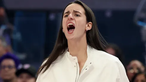 Injured Caitlin Clark #22 of the Indiana Fever cheers on her team.
