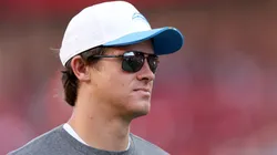 Justin Herbert #10 of the Los Angeles Chargers stands on the field.