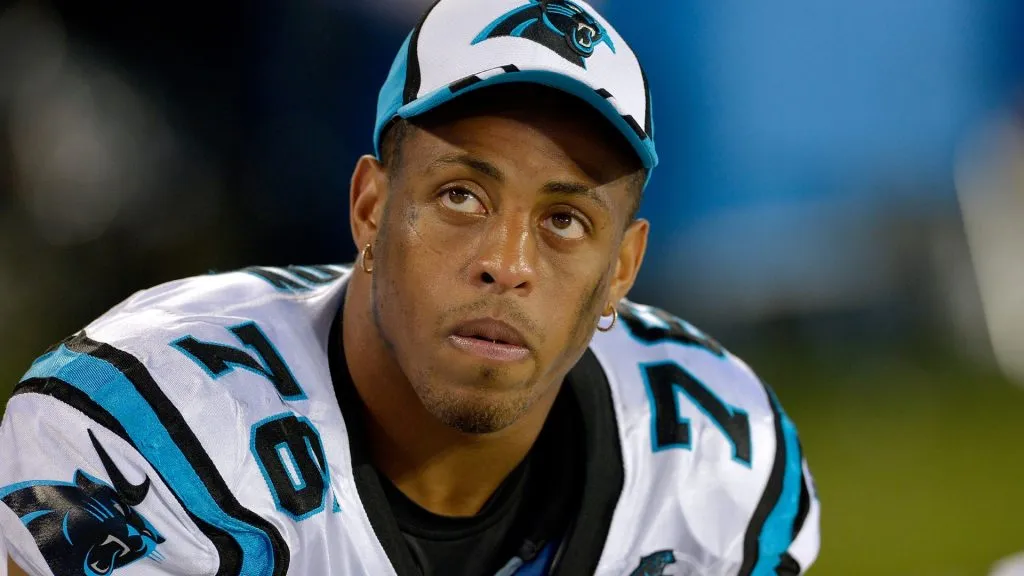 Greg Hardy #76 of the Carolina Panthers watches from the bench during the fourth quarter of a loss in 2014. (Source: Grant Halverson/Getty Images)