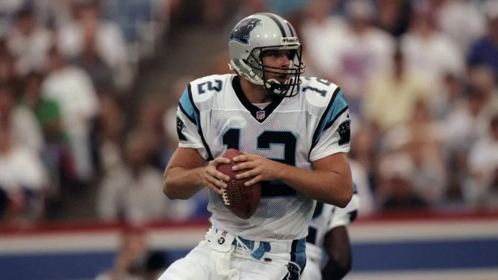 Kerry Collins #12 of the Carolina Panthers in action during a pre-season game against the Buffalo Bills in 1998. (Source: Rick Stewart /Allsports)