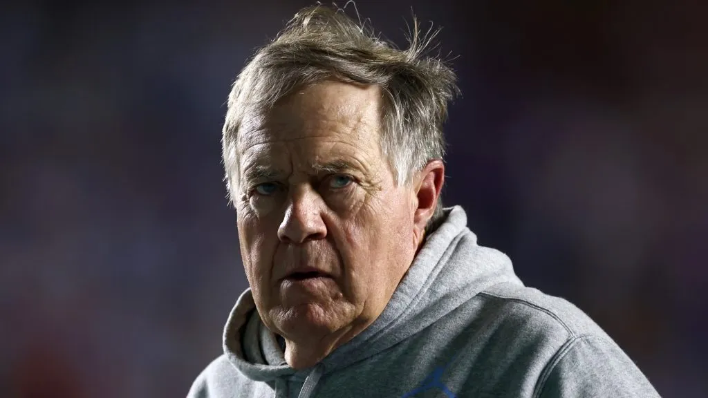 Bill Belichick walks off the field