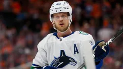 Elias Pettersson #40 of the Vancouver Canucks skates with the puck.