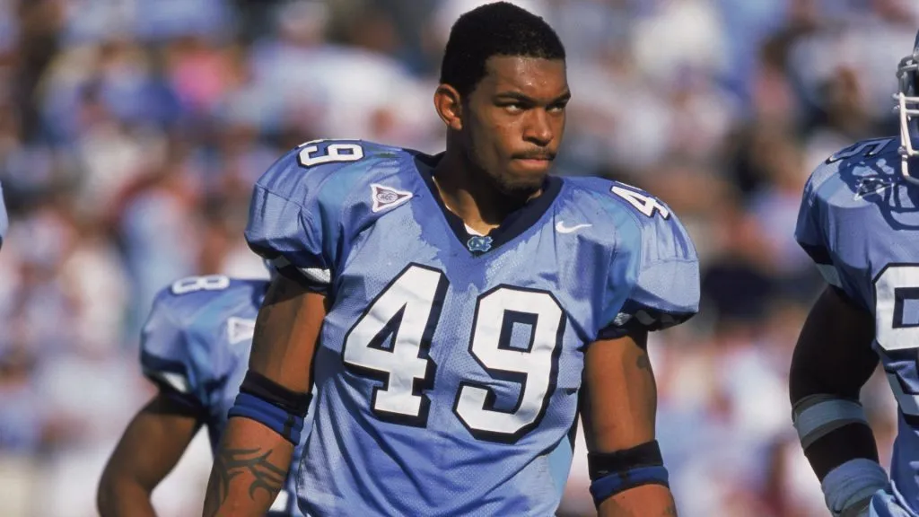 Julius Peppers #49 of the North Carolina Tar Heels holding hishelmet while standing on the field during a game in 2000. (Source: Craig Jones /Allsport)