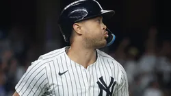 Giancarlo Stanton #27 of the New York Yankees hits a two run home run.