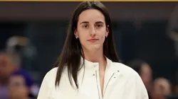 Injured Caitlin Clark #22 of the Indiana Fever stands on the side of the court.