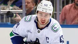 Quinn Hughes #43 of the Vancouver Canucks skates with the puck.